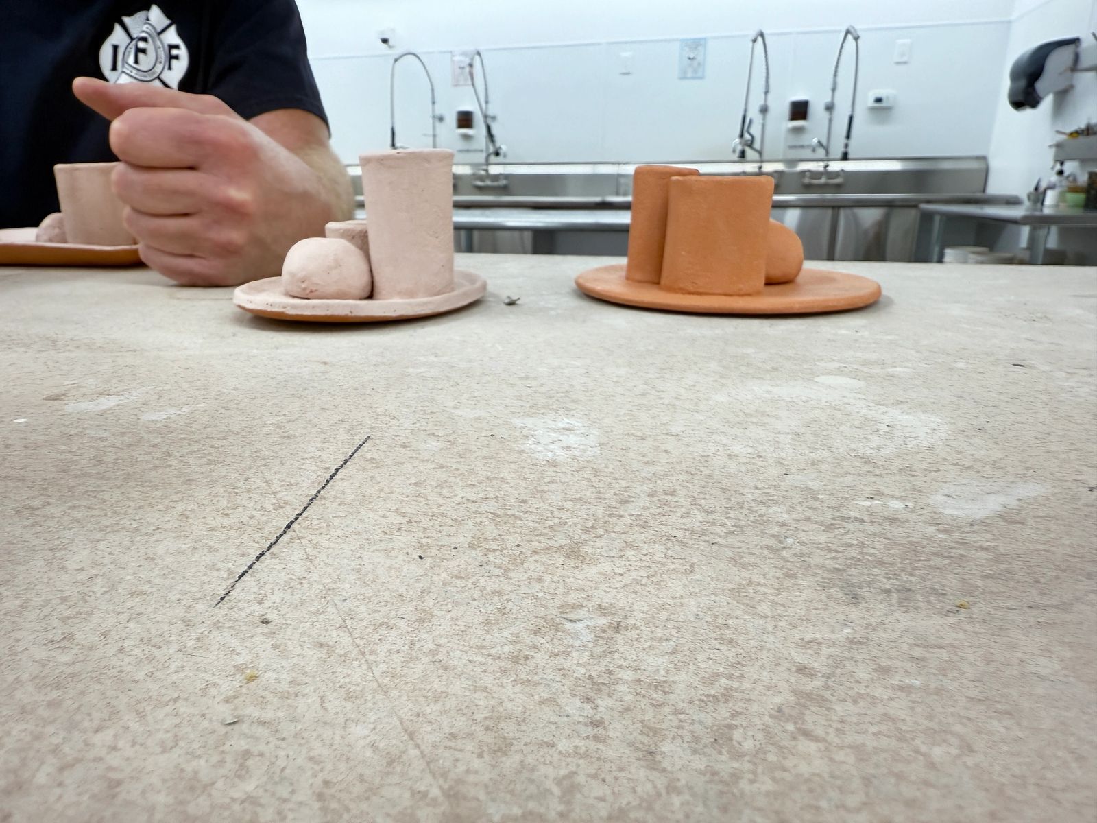 Freshly thrown pieces drying on the studio counter